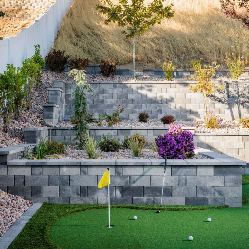 belgard retainig wall with golf underneath